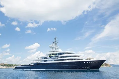 Luxury large super or mega motor yacht in the blue sea. Stock Photos