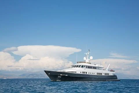 Luxury large super or mega motor yacht in the blue sea. Stock Photos