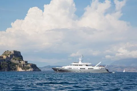 Luxury large super or mega motor yacht on anchor in corfu - greece. Stock Photos