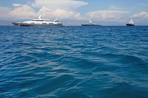 Luxury large super or mega motor yacht in the blue sea. Stock Photos