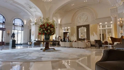 Luxury lobby interior of Hotel de Paris with chandelier tilt shot Stock Footage 337514012