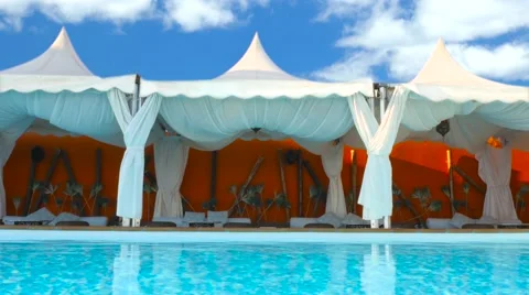Luxury lounge bed in a nice pool area - Time lapse( Clouds) Stock Footage 62213983