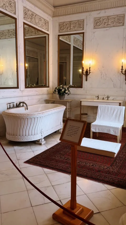 Luxury marble bathroom interior with ornate bathtub and mirrors Stock Footage 330061380
