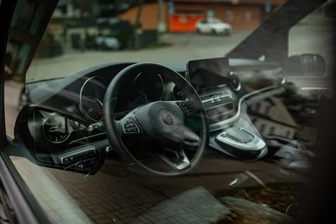 Luxury minivan driver side from outside Stock Photos