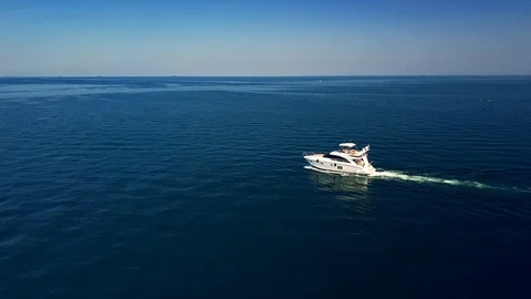 Luxury motor yacht moves on sea Stock Footage 128136403