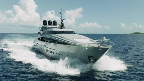 Luxury Motor Yacht Moving Through Tropical Waters in Slow Motion Stock Footage 260653653