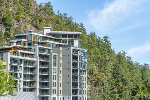 Luxury Mountainside Condominium Complex Surrounded By Evergreen Forest In Van Stock Photos
