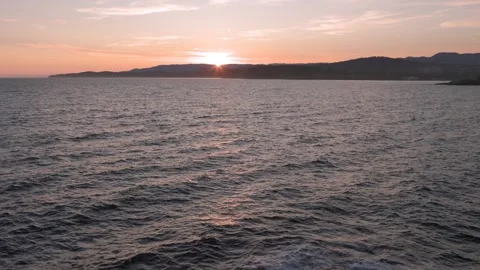 Luxury ocean front condos overlooking beautiful ocean sunset vista, Sooke BC Stock Footage 246610073