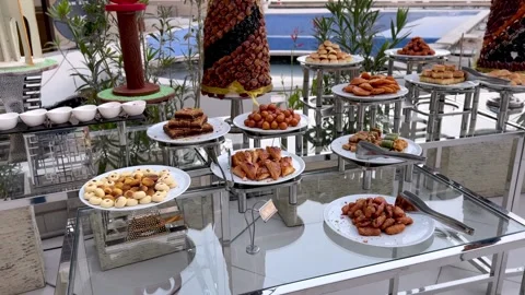 Luxury Outdoor Dessert Buffet with Assorted Arabic Sweets and Date Towers Stock Footage 331165100