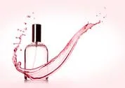 Luxury Pink Liquid  Perfume Bottle With Splashes On Pink Background Stock Photos