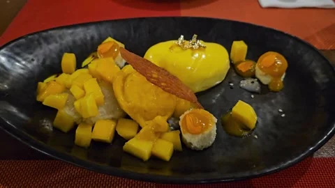 Luxury Plated Mango Mousse Dessert with Gold Leaf and Fresh Fruit Cubes Stock Footage 342625451