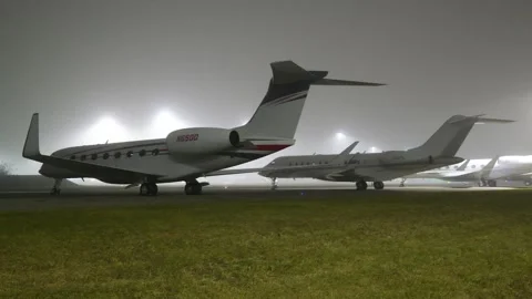 Luxury private jets parked apron stands fbo remote parking area during wef Stock-Footage 300346931