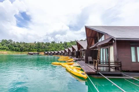 Luxury Resort with Floating Raft Houses on Green Lake with Tropical Trees Stock Photos