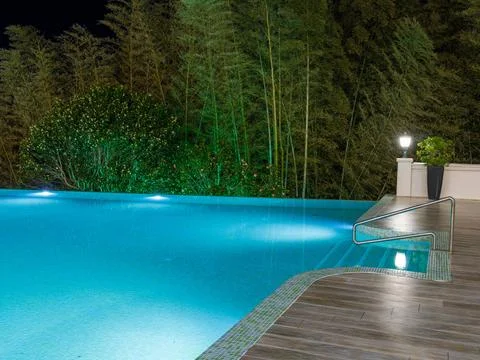 Luxury Resort Infinity Pool at Night Stock Photos