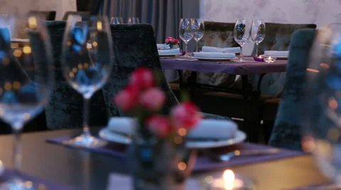 Luxury restaurant table layout  with red roses for dinner being served  Stock Footage 48618543