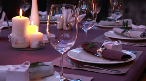 Luxury restaurant table layout with red roses for a romantic dinner Stock Footage 68887745