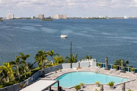 Luxury rooftop infinity pool overlooking Biscayne Bay in Miami. Stock Photos