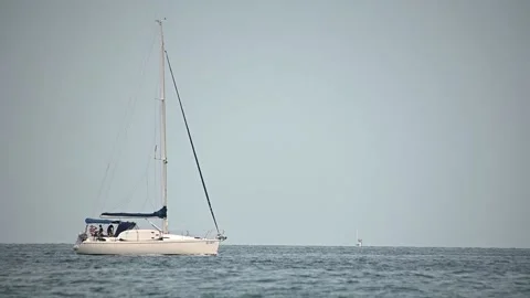 Luxury sailboat passing by. Low angle view of sailing Stock Footage 160589878