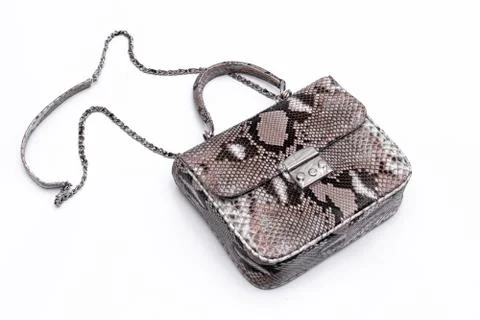 Luxury snakeskin python leather handbag isolated on a white background. Stockfoto's