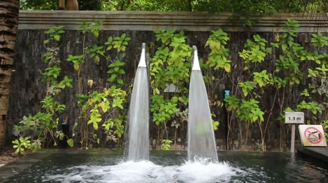 Luxury spa resort. Two artificial waterfalls in the swimming pool. Stock Footage 46513665