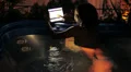 luxury spa - woman surfing in internet on tablet in jacuzzi at night HD Footage