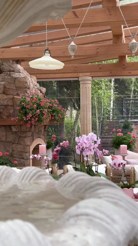 Luxury Summer Gazebo Interior with Decorative Fountain and Orchid Styling 库存影片 334887972
