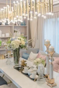 Luxury table set on dinnig table with vase of flower in dining room Stock Photos