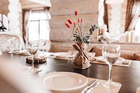 Luxury table setting for dining in a restaurant in pastel colors close up. We Stock Photos