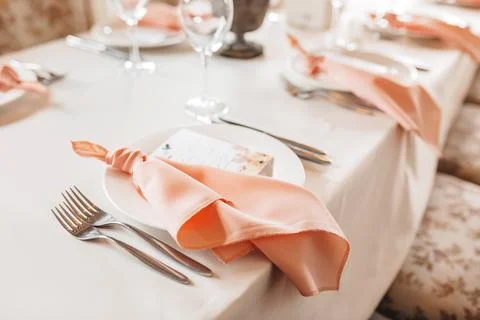 Luxury table setting for dining in a restaurant in pastel colors close up. We Stock Photos