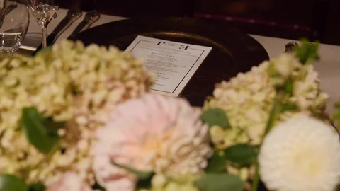 Luxury table setting with menu and flowers, rack focus, closeup Stock Footage 104820318