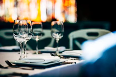 Luxury table settings for fine dining with and glassware, beautiful blurred   Stockfoto's