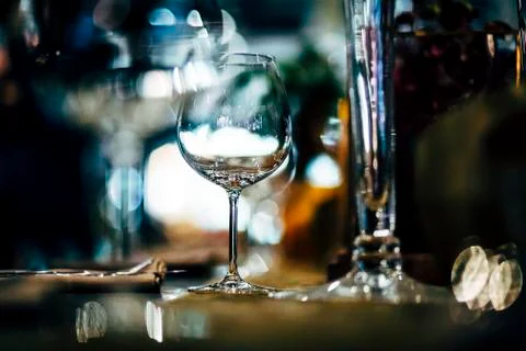 Luxury table settings for fine dining with and glassware, beautiful blurred   Stock Photos