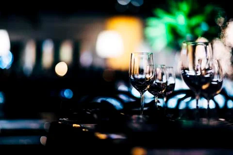 Luxury table settings for fine dining with and glassware, beautiful blurred   Stock Photos