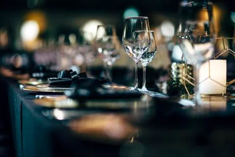 Luxury table settings for fine dining with and glassware, beautiful blurred   Stock Photos