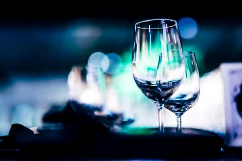 Luxury table settings for fine dining with and glassware, beautiful blurred   Stock Photos