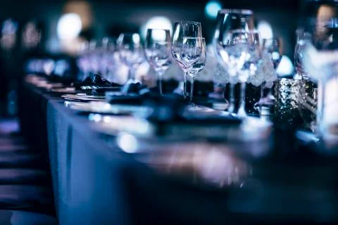 Luxury table settings for fine dining with and glassware, beautiful blurred   Stockfoto's