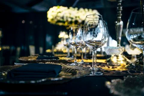Luxury table settings for fine dining with and glassware, beautiful blurred   Stock Photos