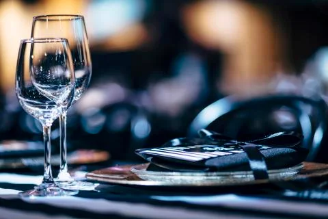 Luxury table settings for fine dining with and glassware, beautiful blurred   Stockfoto's