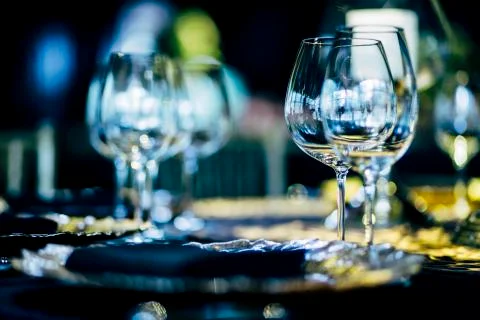 Luxury table settings for fine dining with and glassware, beautiful blurred   Stock Photos