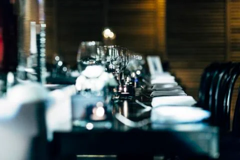 Luxury table settings for fine dining with and glassware, beautiful blurred   Stock Photos