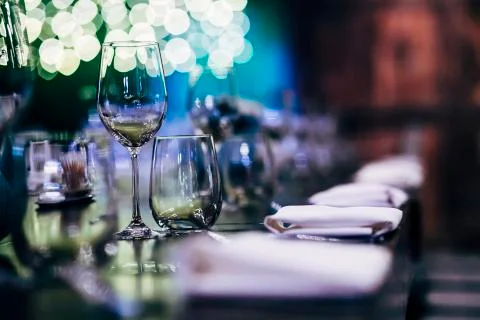 Luxury table settings for fine dining with and glassware, beautiful blurred   Stock Photos