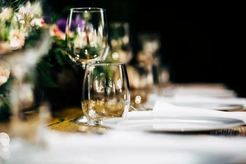 Luxury table settings for fine dining with and glassware, beautiful blurred   Stock Photos