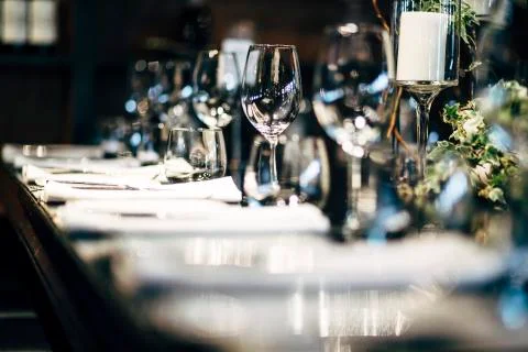 Luxury table settings for fine dining with and glassware, beautiful blurred   Stock Photos