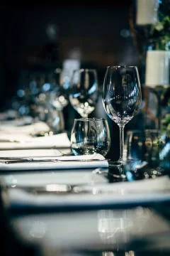 Luxury table settings for fine dining with and glassware, beautiful blurred   Stockfoto's