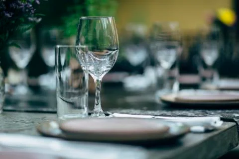 Luxury table settings for fine dining with and glassware, beautiful blurred   Stock Photos