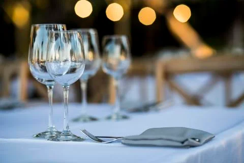 Luxury table settings for fine dining with and glassware, beautiful blurred   Stock Photos