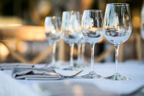 Luxury table settings for fine dining with and glassware, beautiful blurred   Stock Photos
