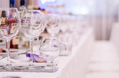 Luxury table settings for fine dining with and glassware, beautiful blurred b Stock Photos