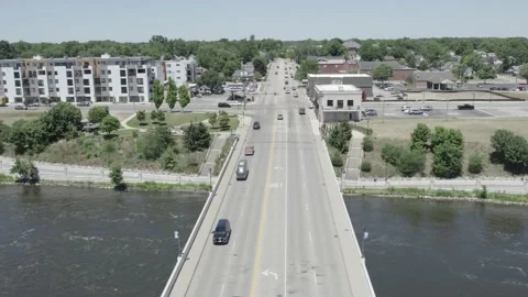Luxury Vehicle Drives over bridge Stock Footage