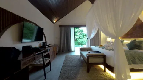 Luxury Villa Bedroom Opening to Infinity Pool and Lush Jungle Stock Footage 337442113